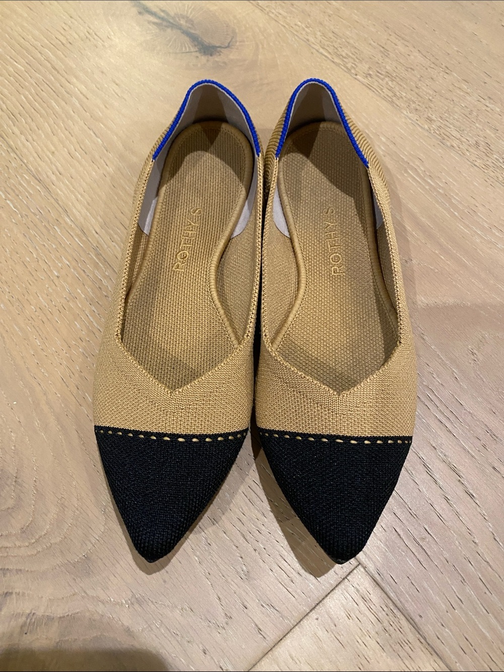 Rothy's Two-Tone Pointed Flats in Tan and Black with Blue Trim